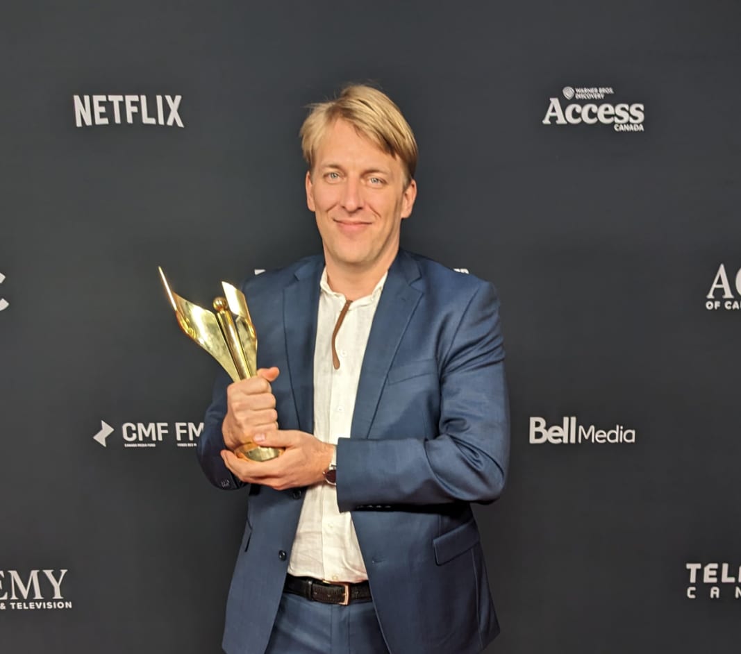 Holding the Canadian Screen Award trophy